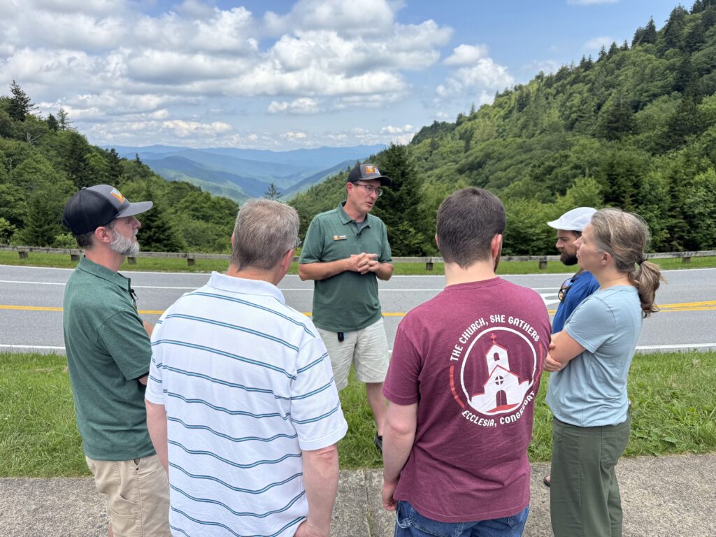 Luke Wayne and Adam Huff of Canyon Ministries teaching a small group beside a mountain road in Great Smoky Mountains National Park