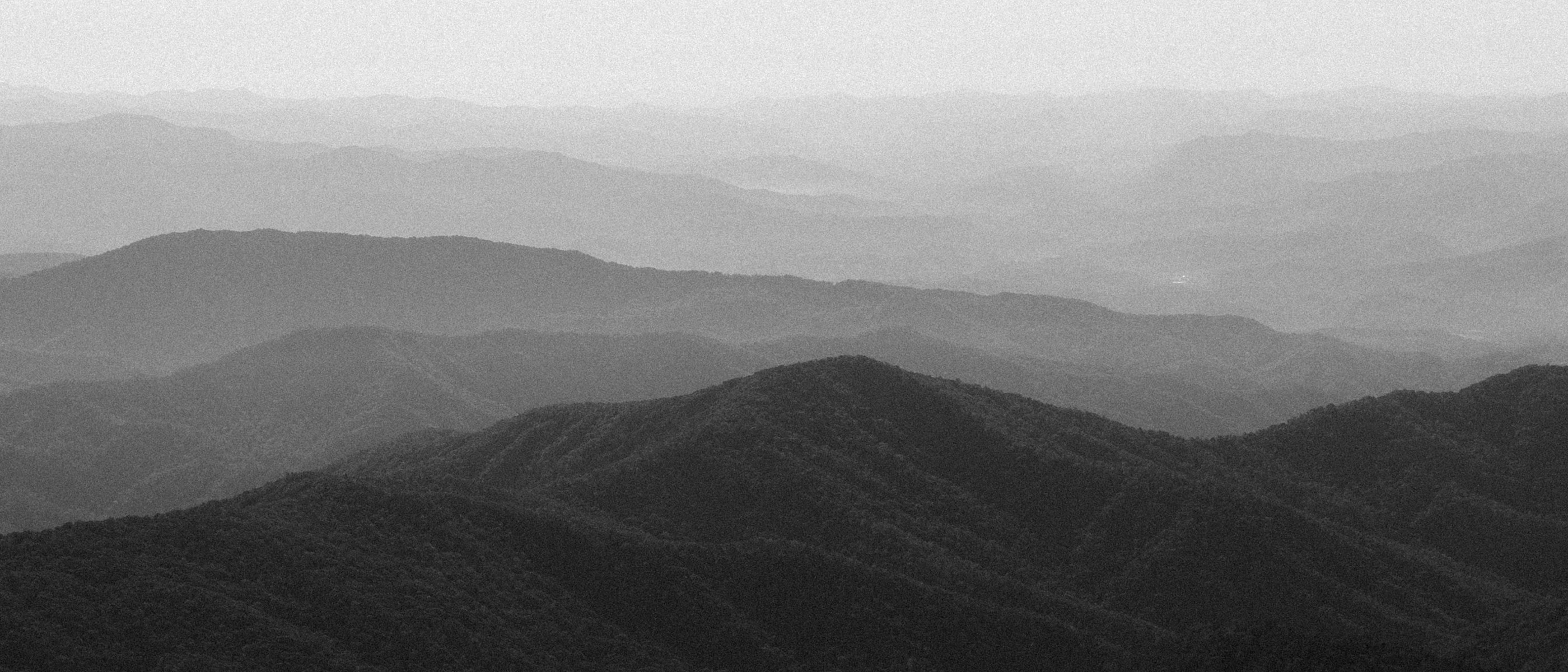 Wide panoramic view of layered foggy mountain ridges in Great Smoky Mountains National Park